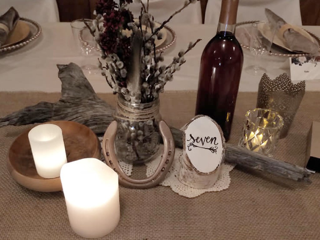 Western style centerpiece with burlap and horseshoes.